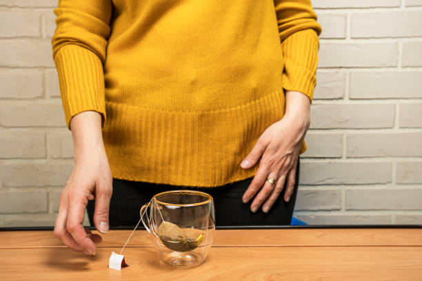 women's caring hands brew delicious fragrant tea