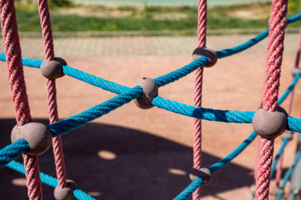 Playground rope tower detail on a sunny day in full frame image.