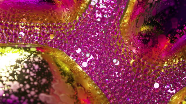 Stream of diamond glowing bubbles. Colored metal objects. Pink gold neon color. Slow motion. Mirror surface.