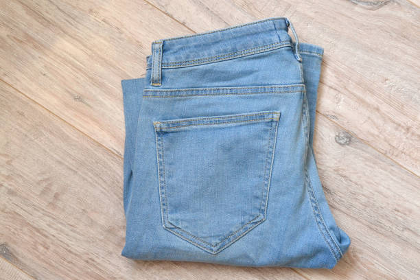 istock light blue men's jeans lie folded 1500419755