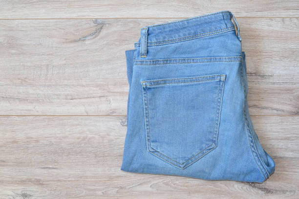 istock light blue men's jeans lie folded on the table 1500420102