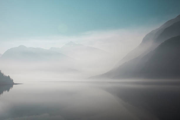 istock Hazy mountains and a lake from BC wildfire smoke 1500421720