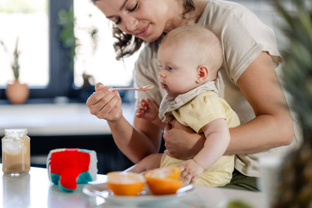 istock Mother feeding her baby 1500422658
