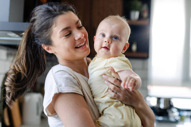 istock Warmth and Happiness: Smiling mother and baby 1500422675