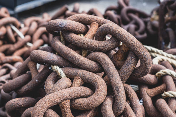 Close up of large rusted chains used for shipping, at a harbour in Gravesend. Matt finish.