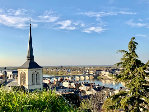 Horizontal high angle view of the historic town of Saumur, the Bridge and the Loire River in Spring.