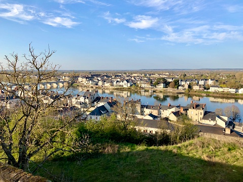 Horizontal high angle view of the historic town of Saumur, and the Loire River in Spring.
