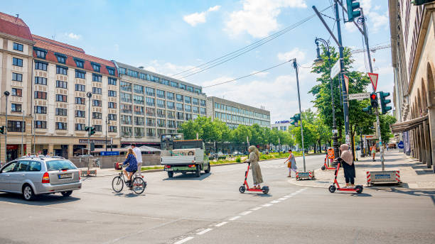 Famous central Unter den Linden street in historical and business downtown of Berlin, with electric scooters stock photo