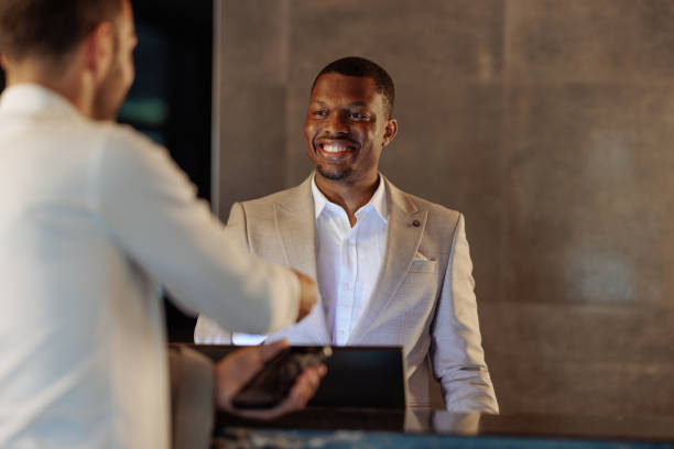 istock Happy African-American hotel receptionist 1500432063