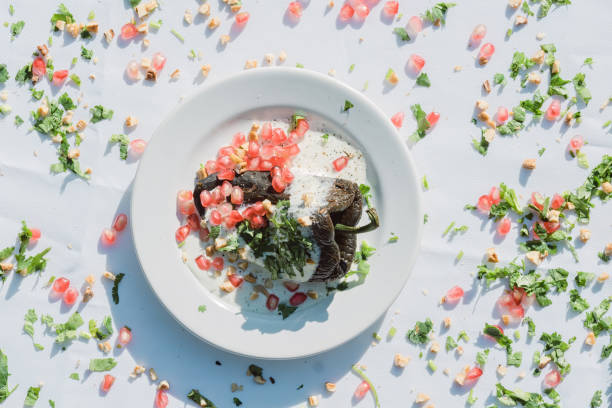istock Chiles en Nogada: A traditional Mexican dish featuring stuffed peppers with walnut sauce and fruit garnish. 1500434539