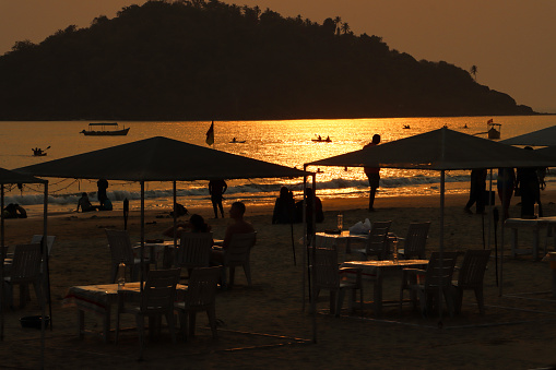 Children playing at the beach in sunset