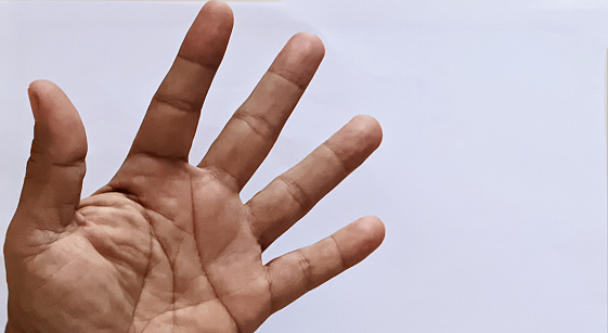 a finger gesturing the number five (5) on a white background