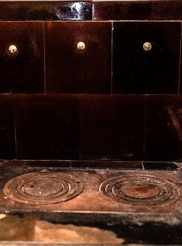 Retro tiled stove close-up. Rustic kitchen interior.