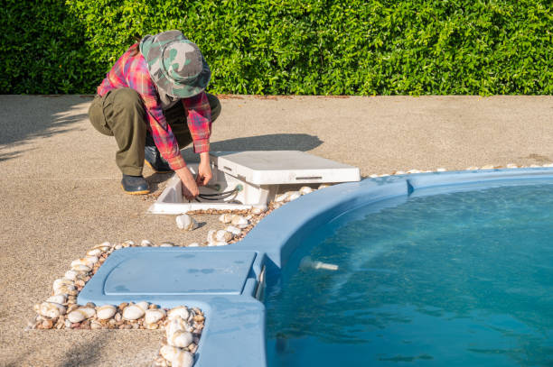 istock Technician trying to fix swimming pool pumps. 1500457085