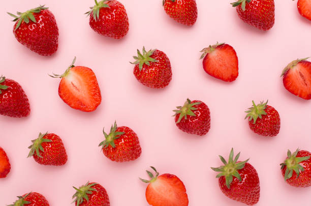 istock Strawberries with leaves on color background, top view 1500457276