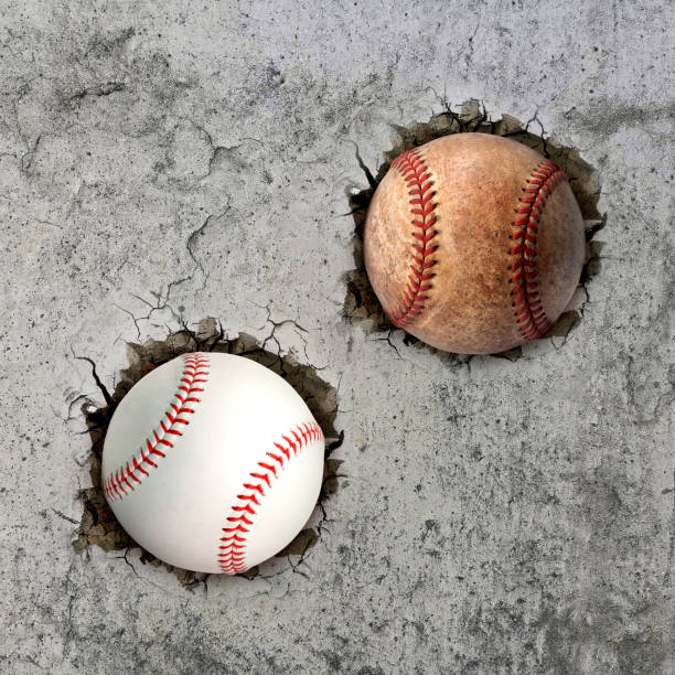 istock Two baseball ball flying through the wall with cracks 1500462917