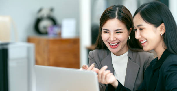 istock Two Young Asian businesswoman discuss with new startup project Idea presentation 1500464251