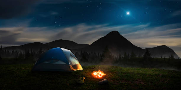 tent under the moonlight in the mountain abyss