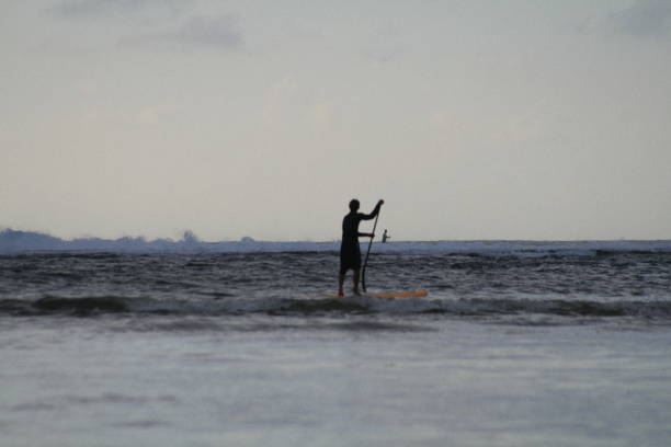 istock SUP paddler at dusk 1500477307