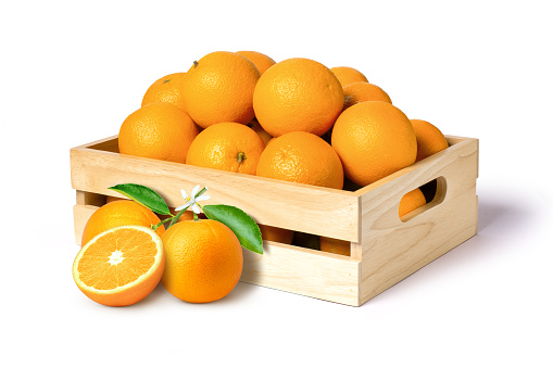 Orange fruit in wooden box isolated on white background