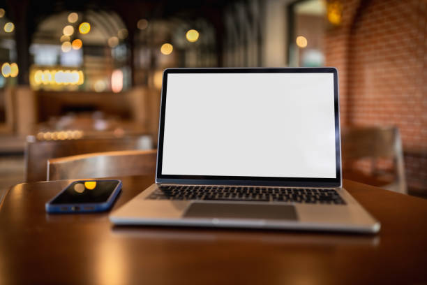 istock Men using laptop computer displays working at home with a blank white desktop screen monitor and a blank design mockup technology mockup communication marketing and design
Â 1500481946