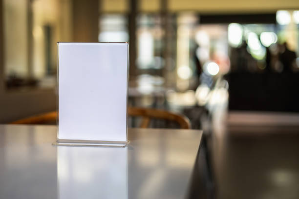 istock Stand Mock up Menu frame tent card blurred background design key visual layout in cafe 1500481956