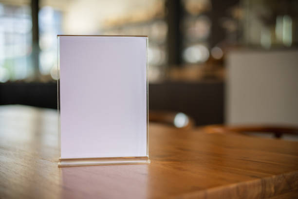 istock Stand Mock up Menu frame tent card blurred background design key visual layout in cafe 1500481959