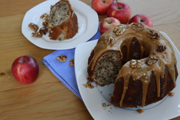 istock Apple and Walnut Bundt Cake with slice on a plate on wooden table 1500482258