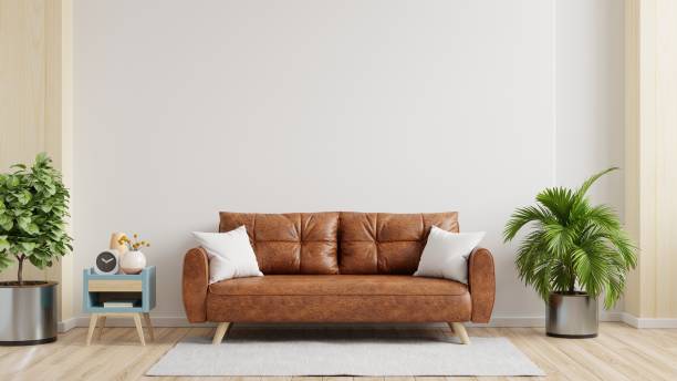istock White wall interior living room have orange leather sofa and decoration minimal. 1500485322