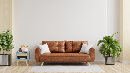 White wall interior living room have orange leather sofa and decoration minimal.