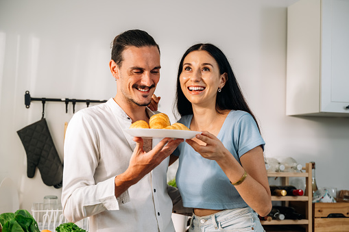 Healthy lovers cooking food in kitchen, Happy young couple spending time together at home, Husband and wife relaxing and resting at modern house, Family and lovers with hobby lifestyle