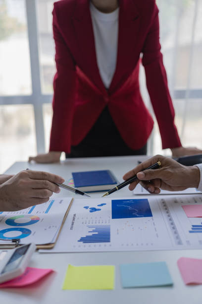 istock A multiracial team of analysts and laptops in analyzing financial data to make strategic decisions. Fintech analyzes market metrics In the office 1500488898