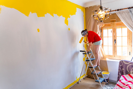 Yellow Wall Revamp: Woman Transforms Her Home with Paint