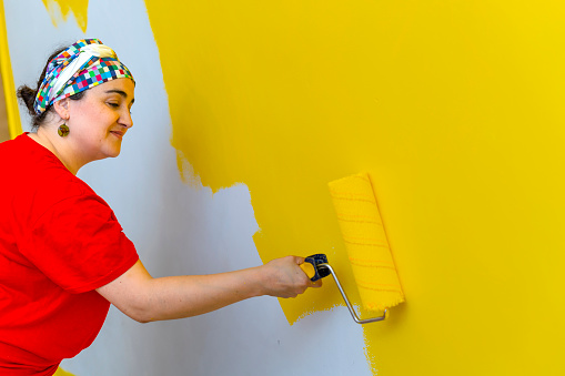 Renovating the House: Woman Embraces Yellow for a Cheerful Look