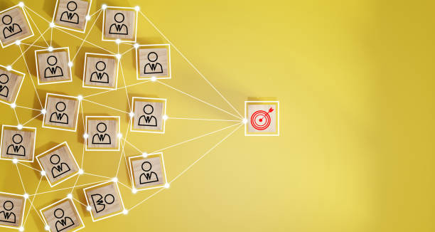 istock Red dartboard and black arrow connection linkage with human icon for customer focus target group and customer relation management concept. 1500489171
