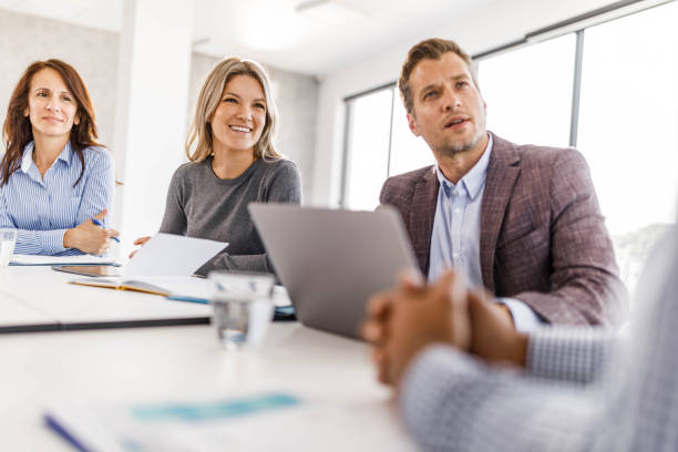 istock Happy entrepreneurs talking on a meeting in the office. 1500491292