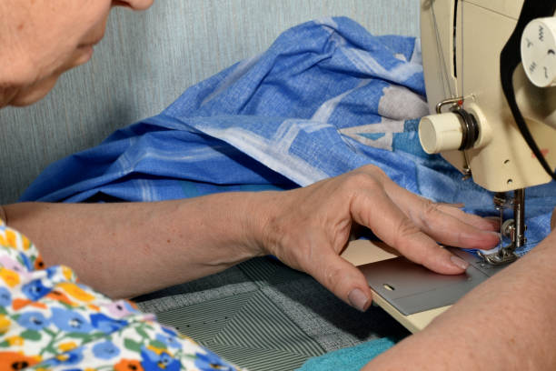 istock A seamstress works at a sewing machine that is on the table. 1500491471