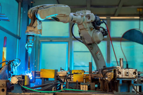 welding robots represent the movement. in the automotive parts factory. - car bodywork flash imagens e fotografias de stock