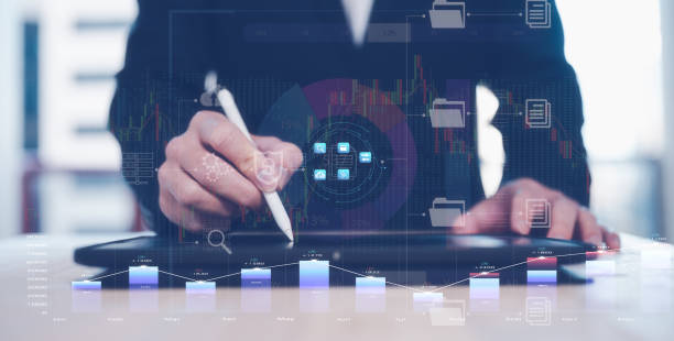 istock financial investment concept, businessman using computer tablet with virtual trading graph stock or cryptocurrency exchange in concept of investment business growth and marketing 1500493937