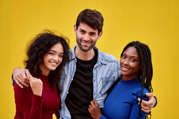 istock Multi-ethnic friends looking at camera and smiling while posing together. 1500494252