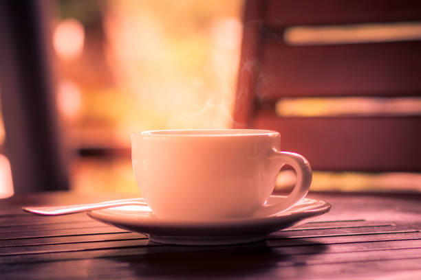 hot coffee on wooden table