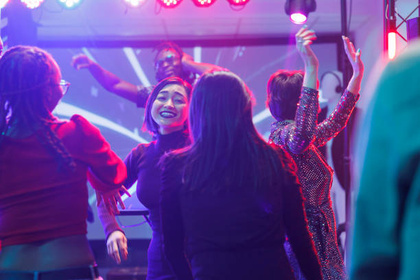 istock Happy girlfriends partying in club 1500496277
