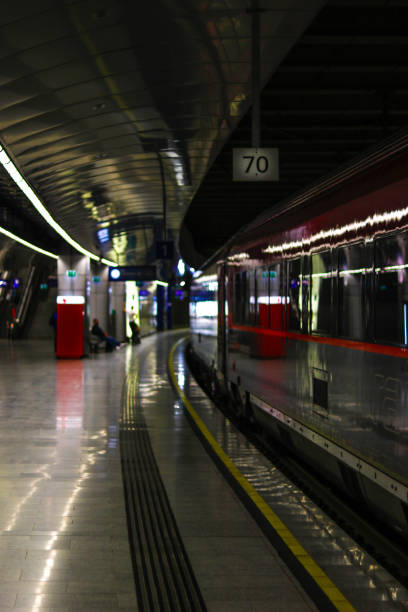 istock A train passes through the subway while people wait at the station 1500497540