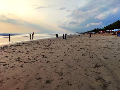People watching the beautiful sunset at Kuta beach, the most popular tourist resort in Bali.\nIndonesia\nNikon