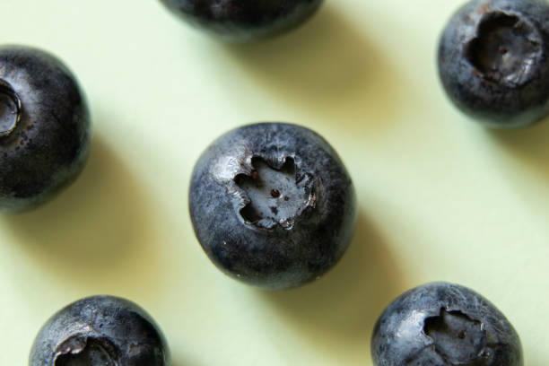 ripe blueberries on a light background close up ripe blueberries on a light background close-up dissert stock pictures, royalty-free photos & images