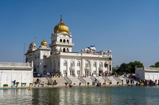 New Delhi, India - April 11, 2023: Exterior view of Gurudwara Bangla Sahib, a famous Sikh house of worship.