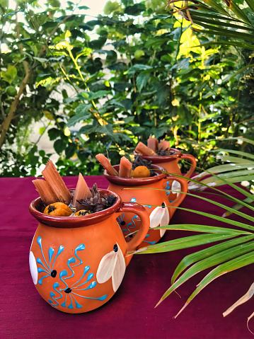 Flavors of Mexico with a warm and aromatic tejocote ponche, served in exquisite dishware