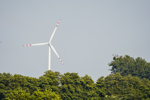 Wind turbine in the field. Renewable energy windmill. Ecology. Energy.