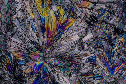 Sugar crystals photographed with polarized light at great magnification, creating an original color palette