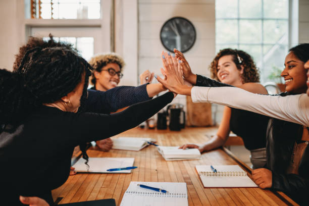 istock Students are celebrating together with an high-five 1500510999